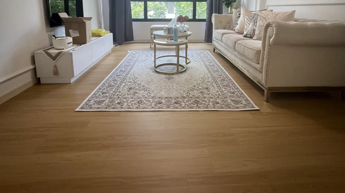 Warm oak vinyl flooring laid by LN in a BTO living room at Tampines North