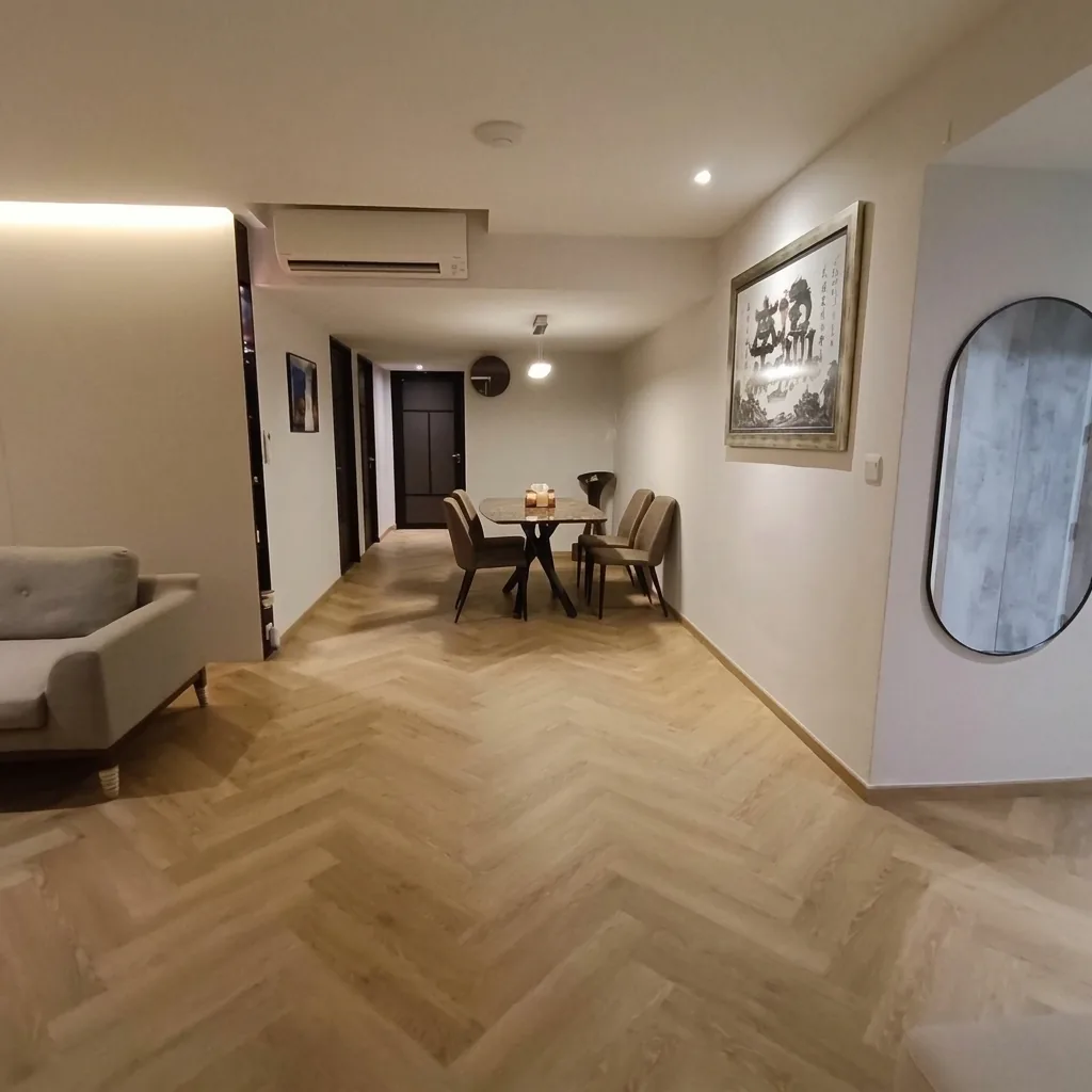 Herringbone vinyl flooring installation by LN Flooring in a Singapore condo dining and entry area