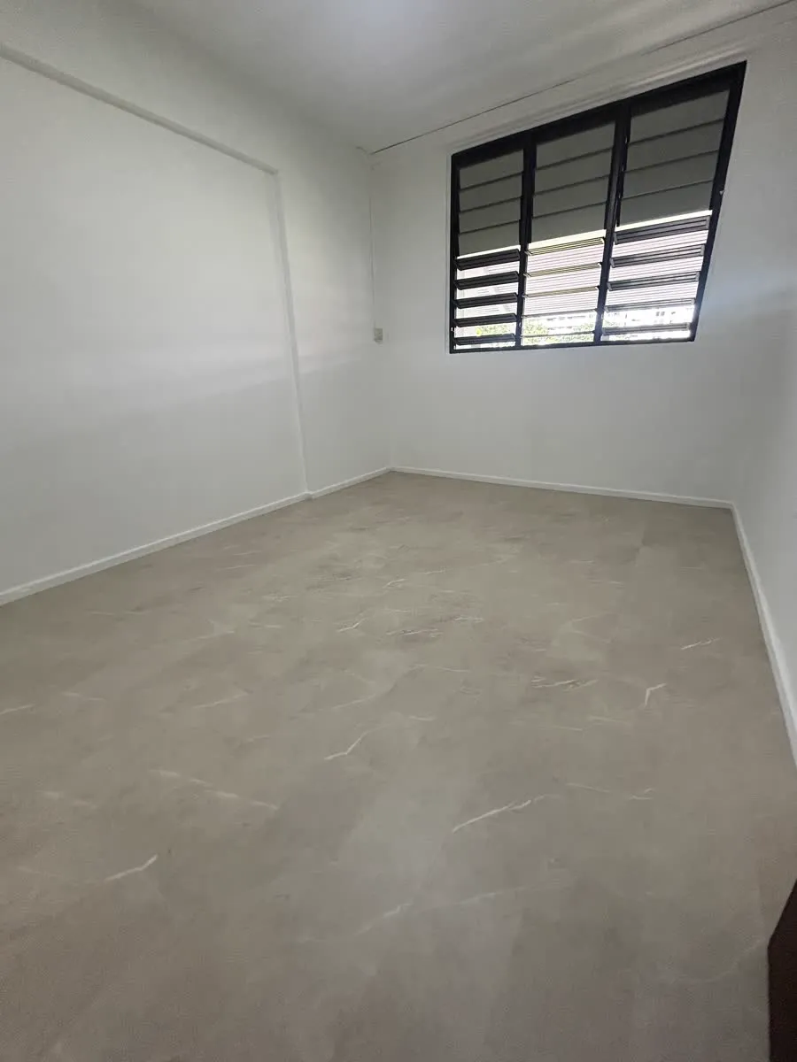 Completed HDB room with marble-look LVT overlay floor in Ubi