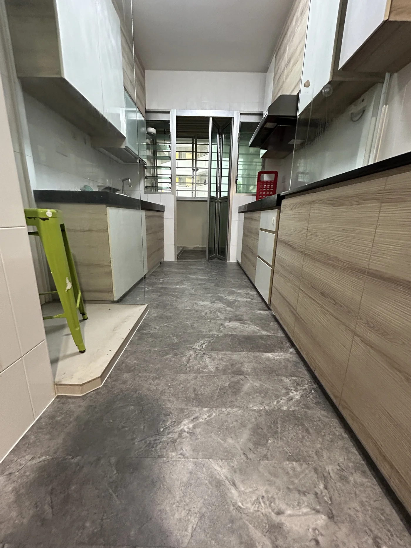 Stone-look vinyl overlay laid over the existing kitchen tiles in the same Choa Chu Kang flat