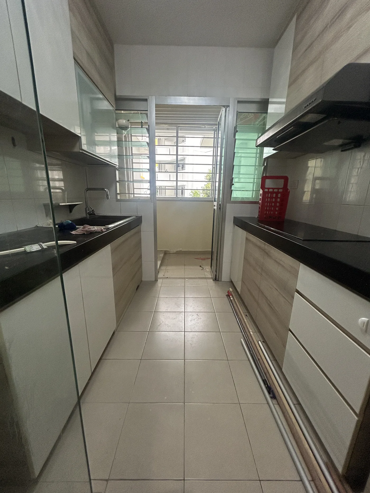 Existing HDB kitchen floor tiles in a Choa Chu Kang flat before vinyl overlay