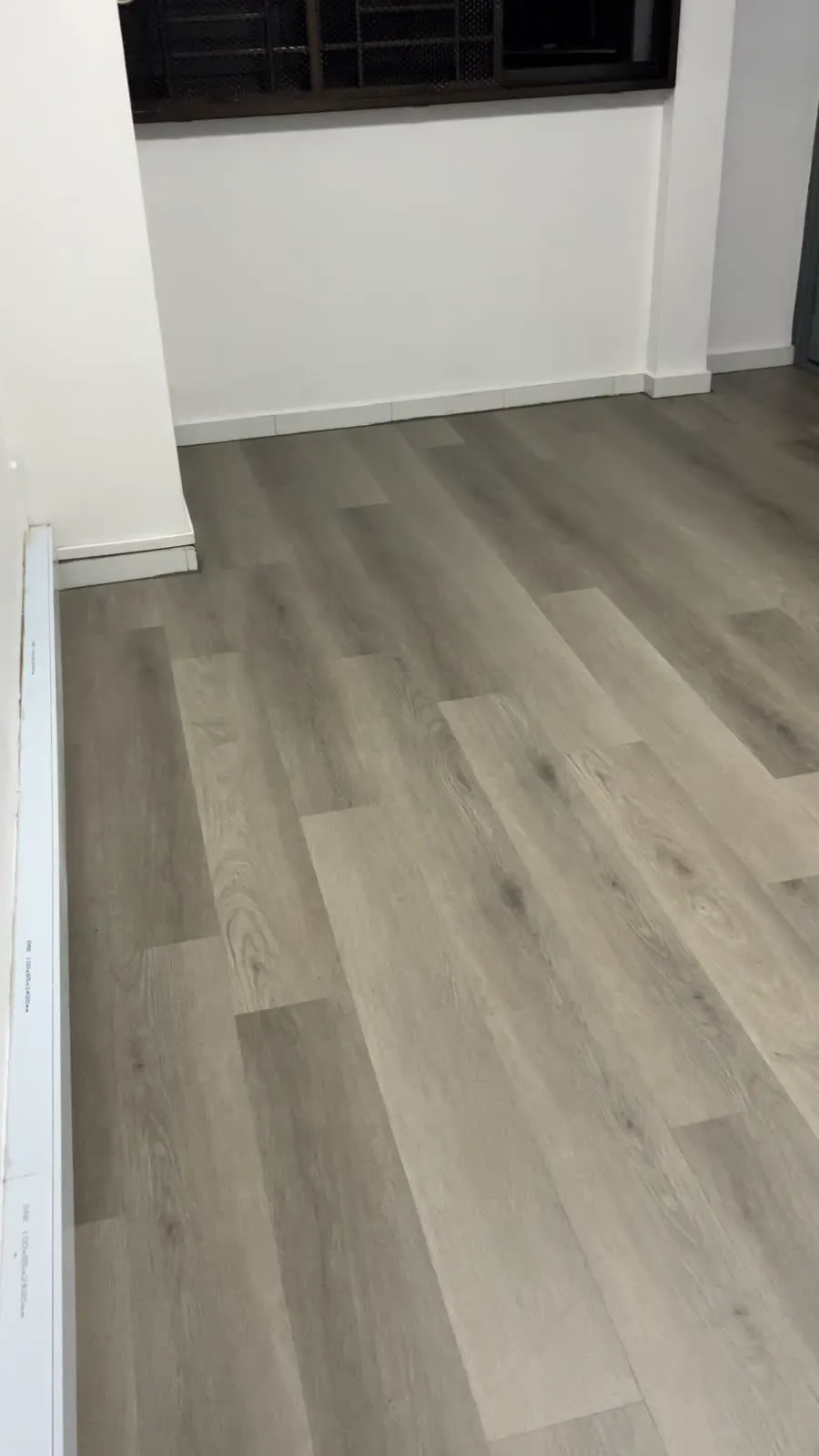 Completed HDB vinyl overlay floor in light oak wood-grain LVT, Ang Mo Kio