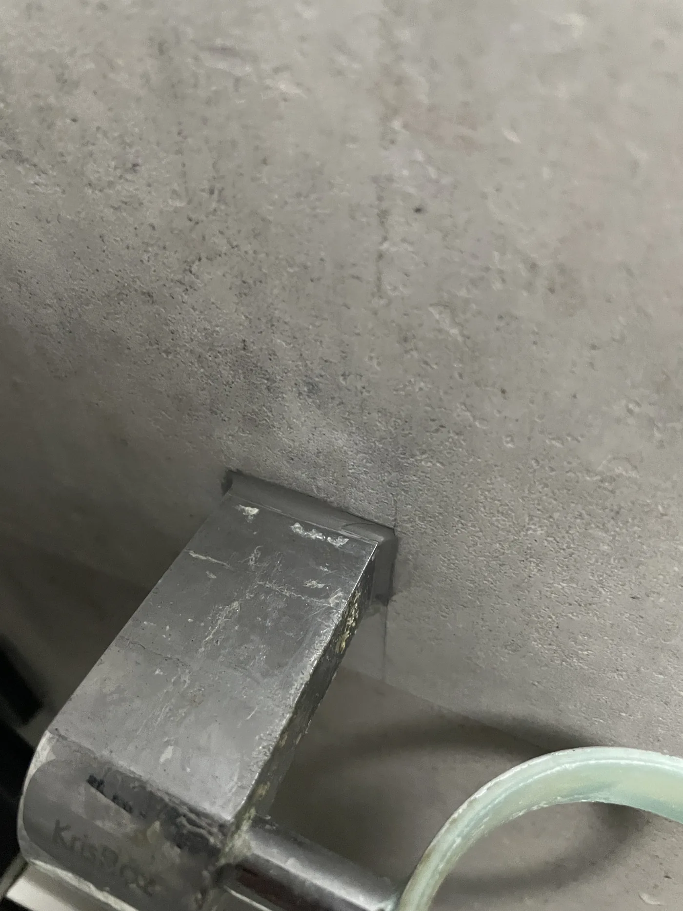 Wall-to-floor junction detail during a Singapore bathroom fit-out