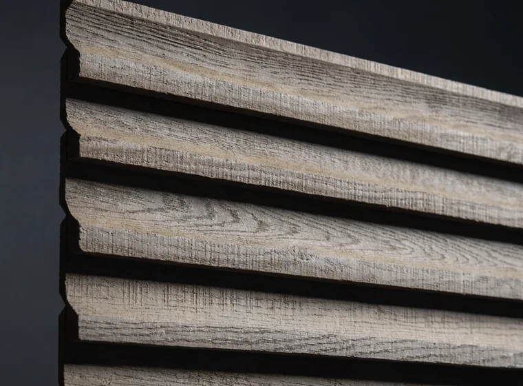 Macro close-up of exterior wall cladding: wide overlapping horizontal weathered timber boards