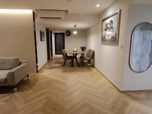 Condo dining area with herringbone vinyl flooring