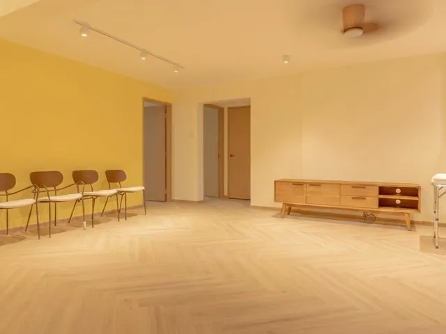 HDB living room with herringbone vinyl flooring