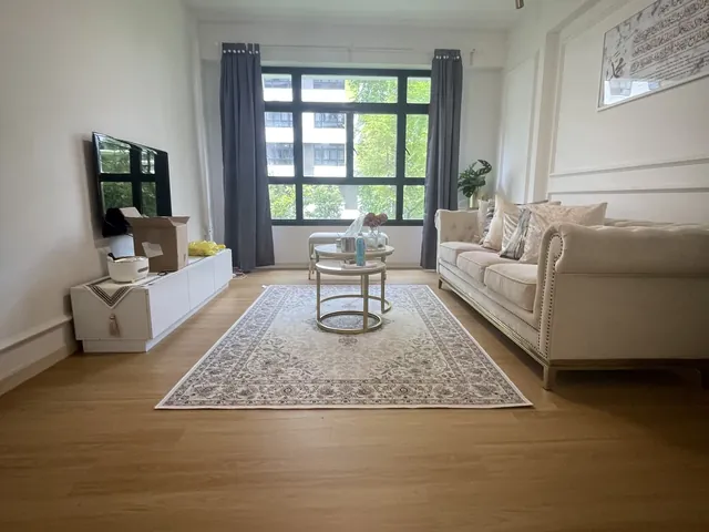 Tampines living room with warm oak vinyl flooring